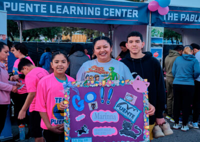 family support girl at la big5k marathon who is running for puente learning center